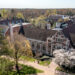 A shot above McCain Library, a gothic brick structure with large windows. Spring buds begin to blossom on the trees