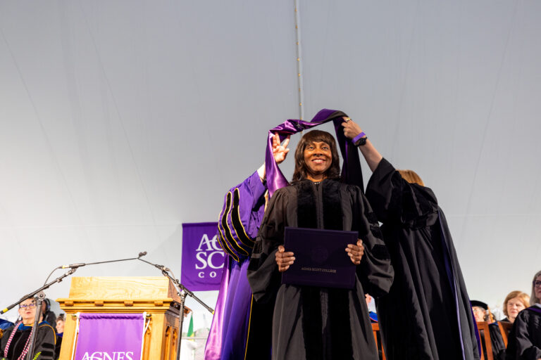 Wonya Lucas receiving her honorary hood and diploma.