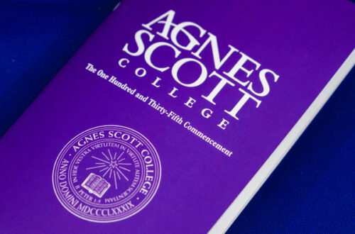 a purple commencement program with the logo of Agnes Scott College