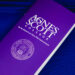 a purple commencement program with the logo of Agnes Scott College