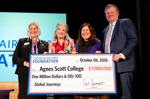 President with Leocadia I. Zak, Gail Grimmett, President & CEO of Delta Flight Museum, and Vice President for College Advancement Cheryl Webster holding a check for one million dollars.